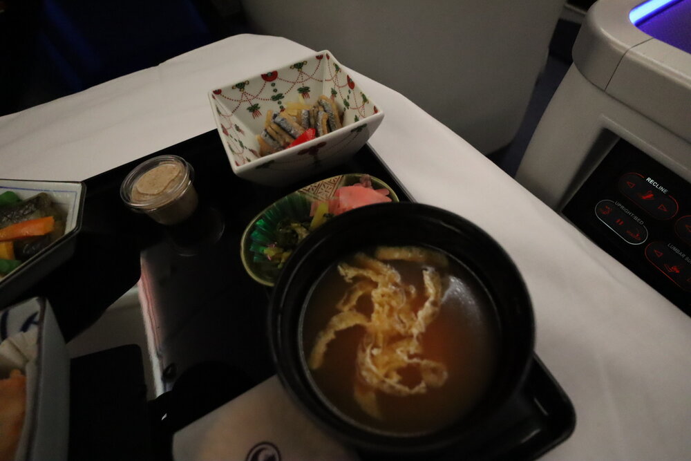 ANA 787 business class – Miso soup and herring bites