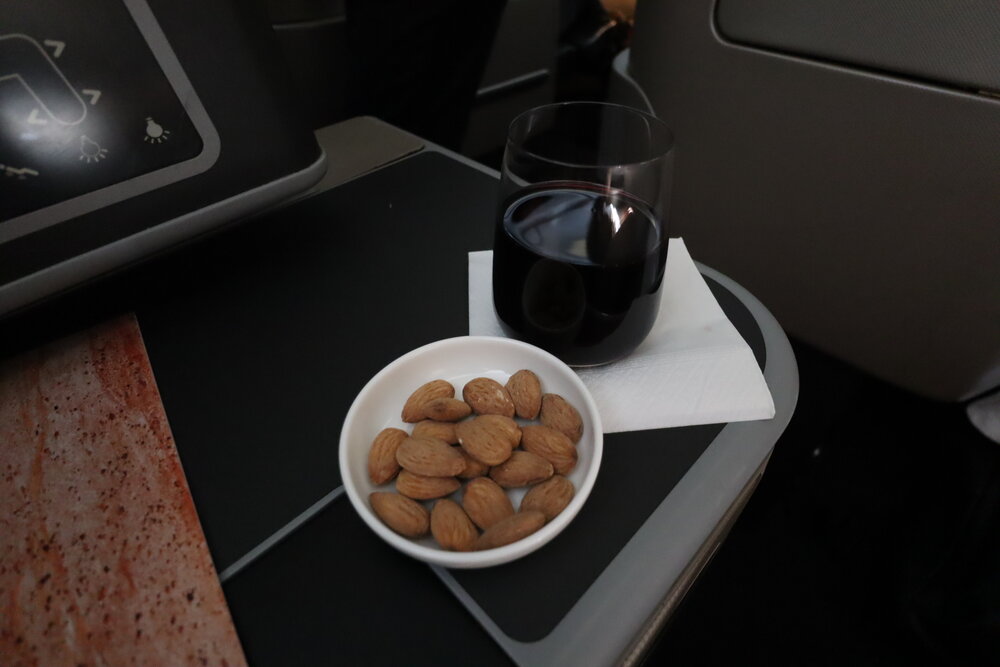 Qantas business class – Shiraz red wine and almonds