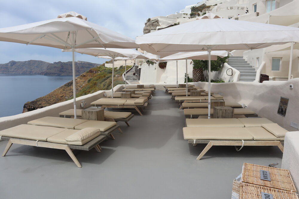 Mystique Santorini – Poolside lounge chairs