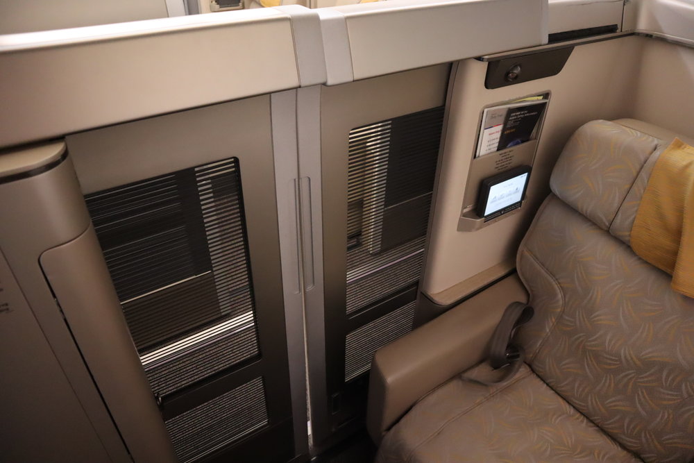 Asiana Airlines First Class – Enclosed suite with doors closed