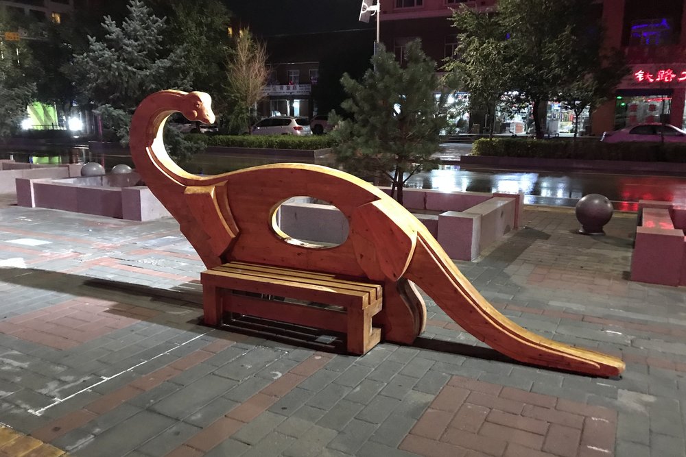 Dinosaur-themed bench in Erlian