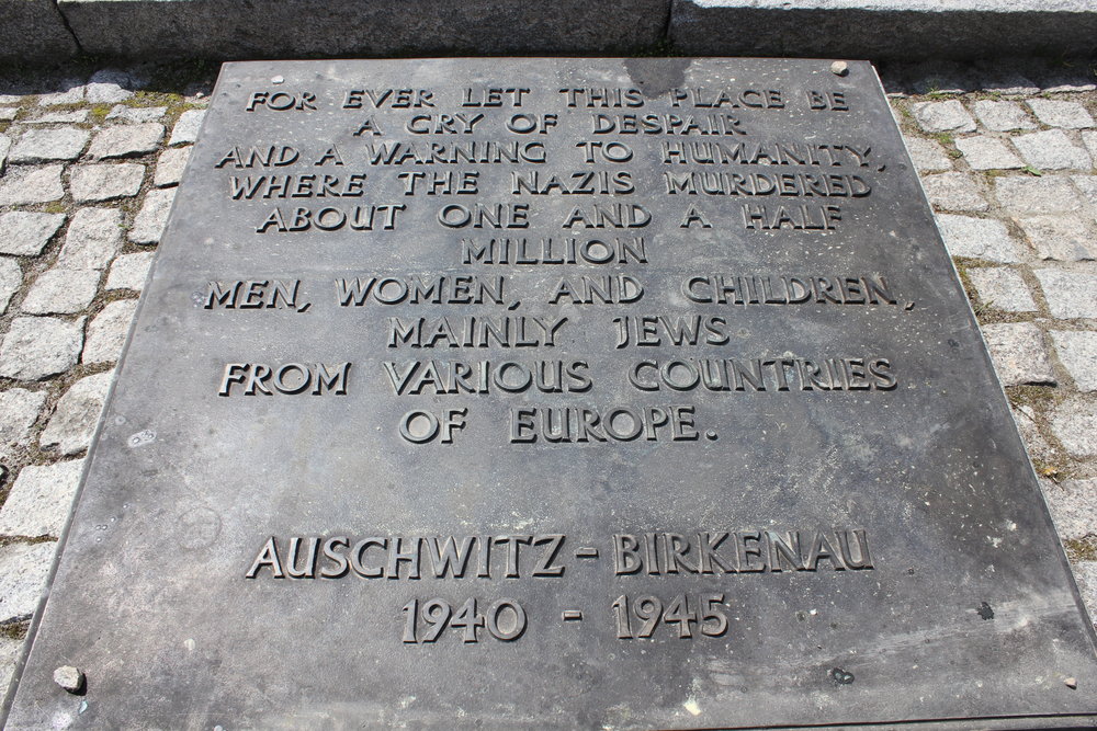 The English memorial plaque at Birkenau – between the ruins of Krema II and Krema III, there lies a row of granite slabs with the above text inscribed in every major language of Europe