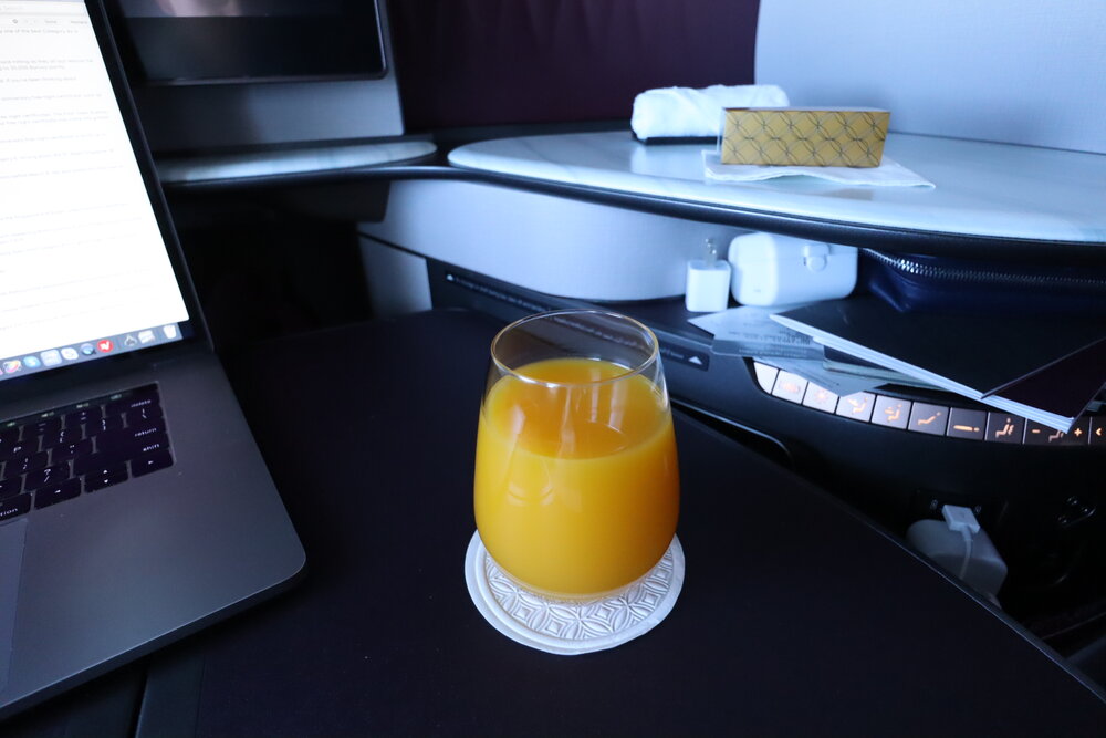 Qatar Airways 777 Qsuites business class – Orange juice