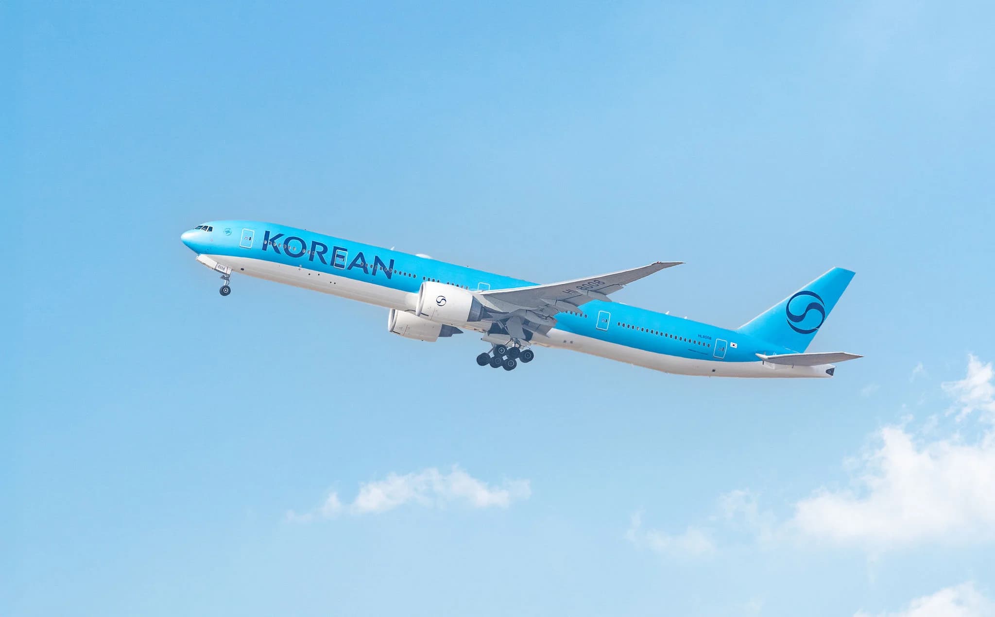 Korean Air Boeing 777-300ER in new livery climbing after takeoff