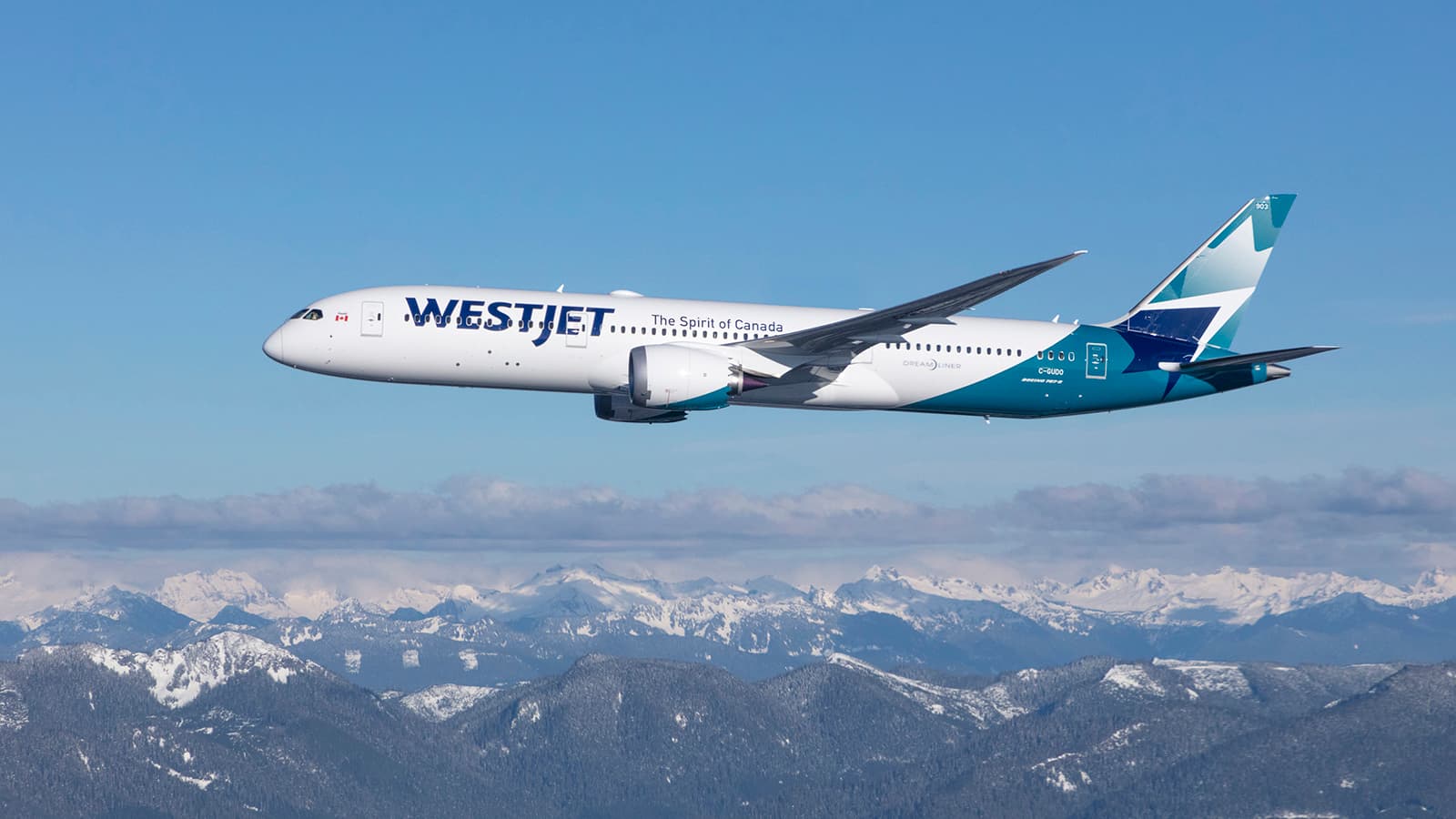 WestJet Boeing 787-9 Dreamliner flying over the Rocky Mountains