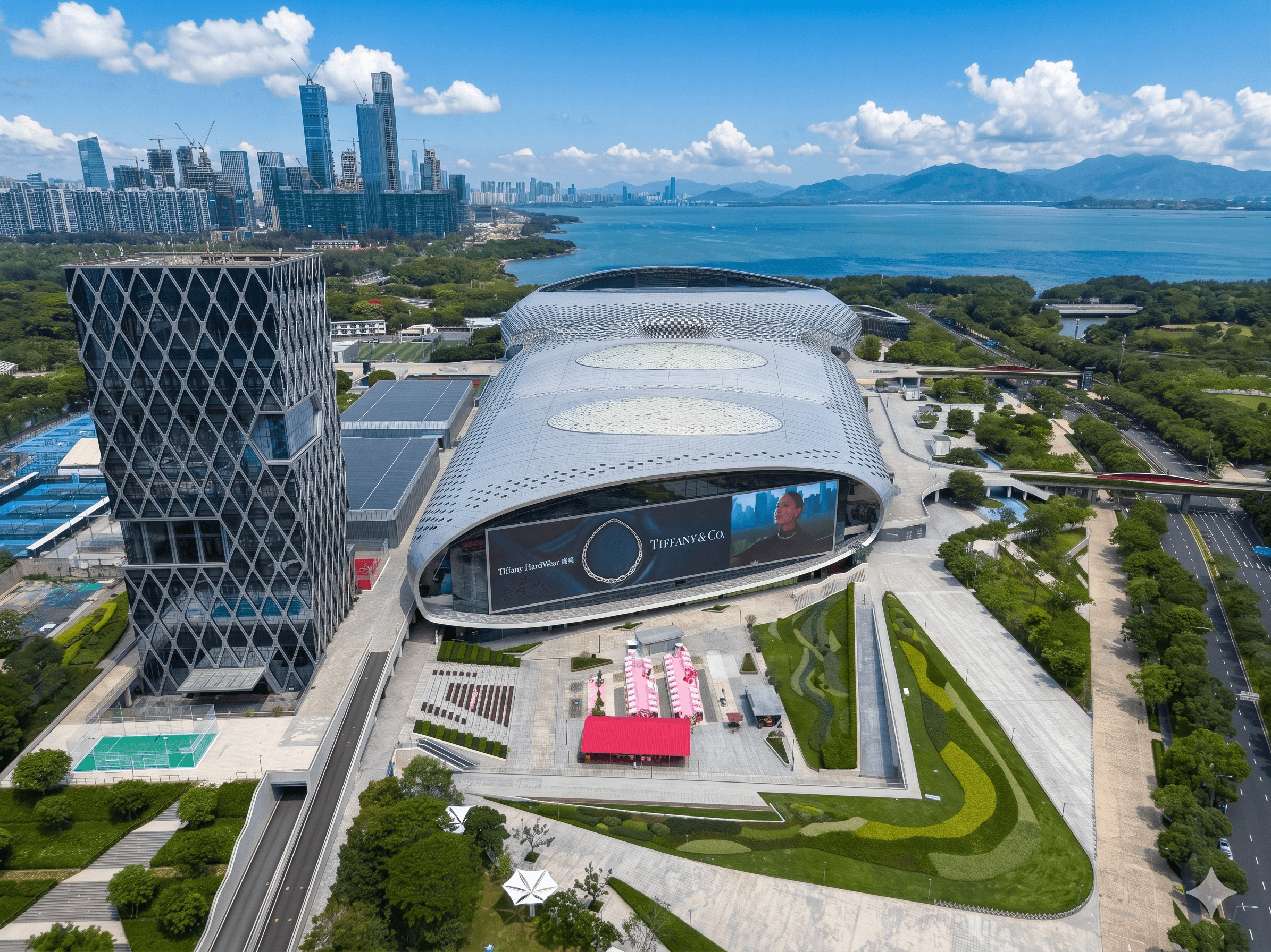 Aerial view of the Shenzhen Bay area with the Shenzhen Bay Sports Centre and surrounding skyline