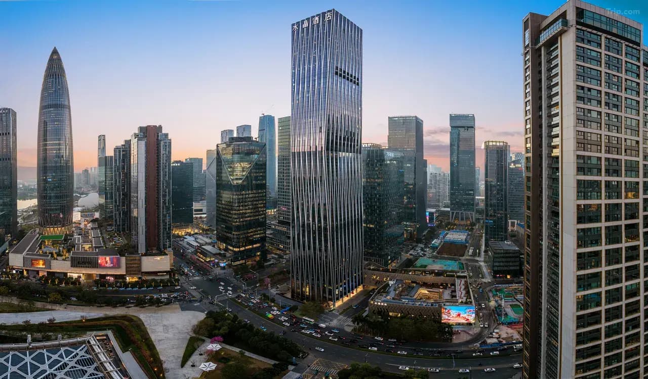 Crystal Orange Shenzhen Bay MixC tower in the Shenzhen skyline at dusk