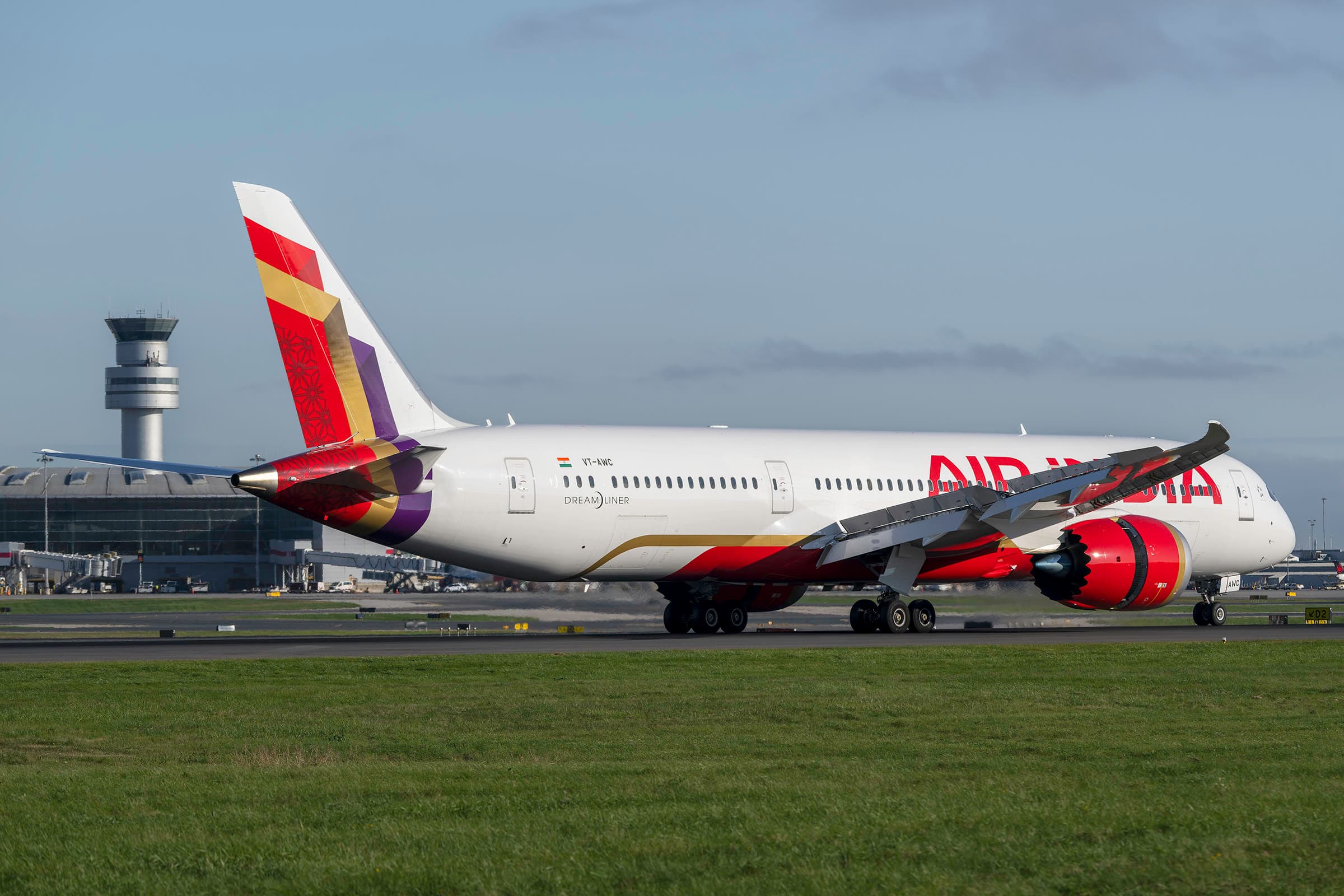 Air India Boeing 787-9 in the new livery on the runway at Toronto Pearson, with the control tower behind it