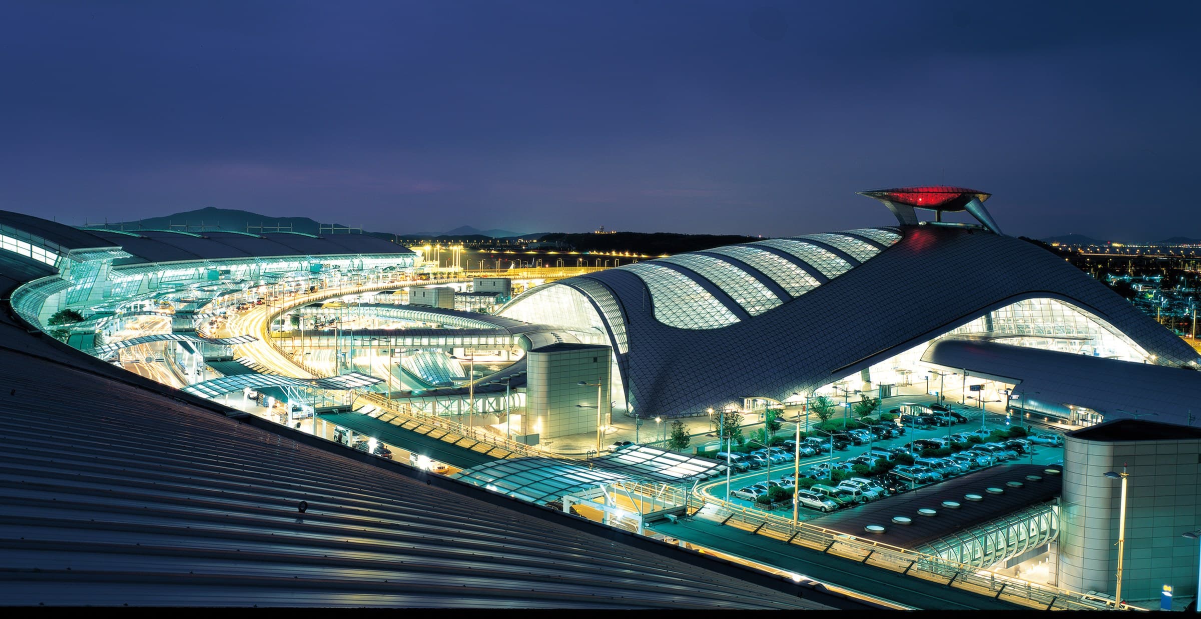 Incheon International Airport Terminal 1 and its transportation centre at night