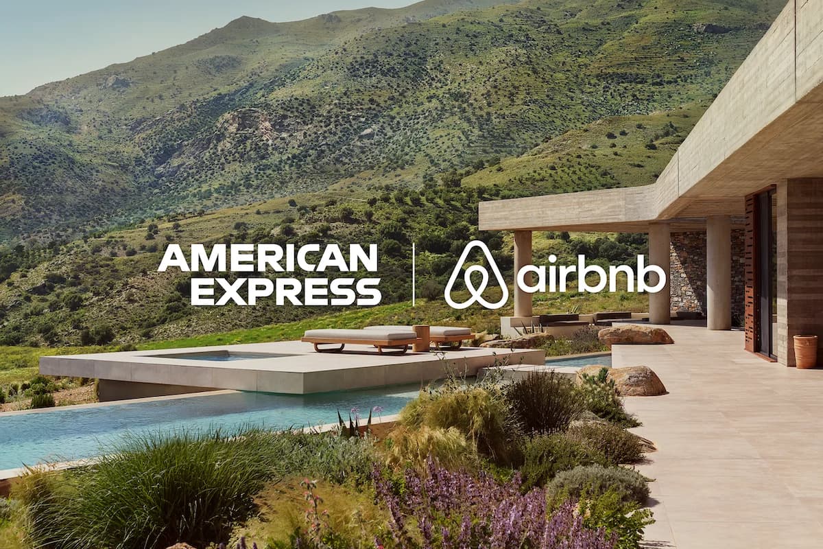 American Express and Airbnb logos over an Airbnb Luxe villa with a pool and mountain views