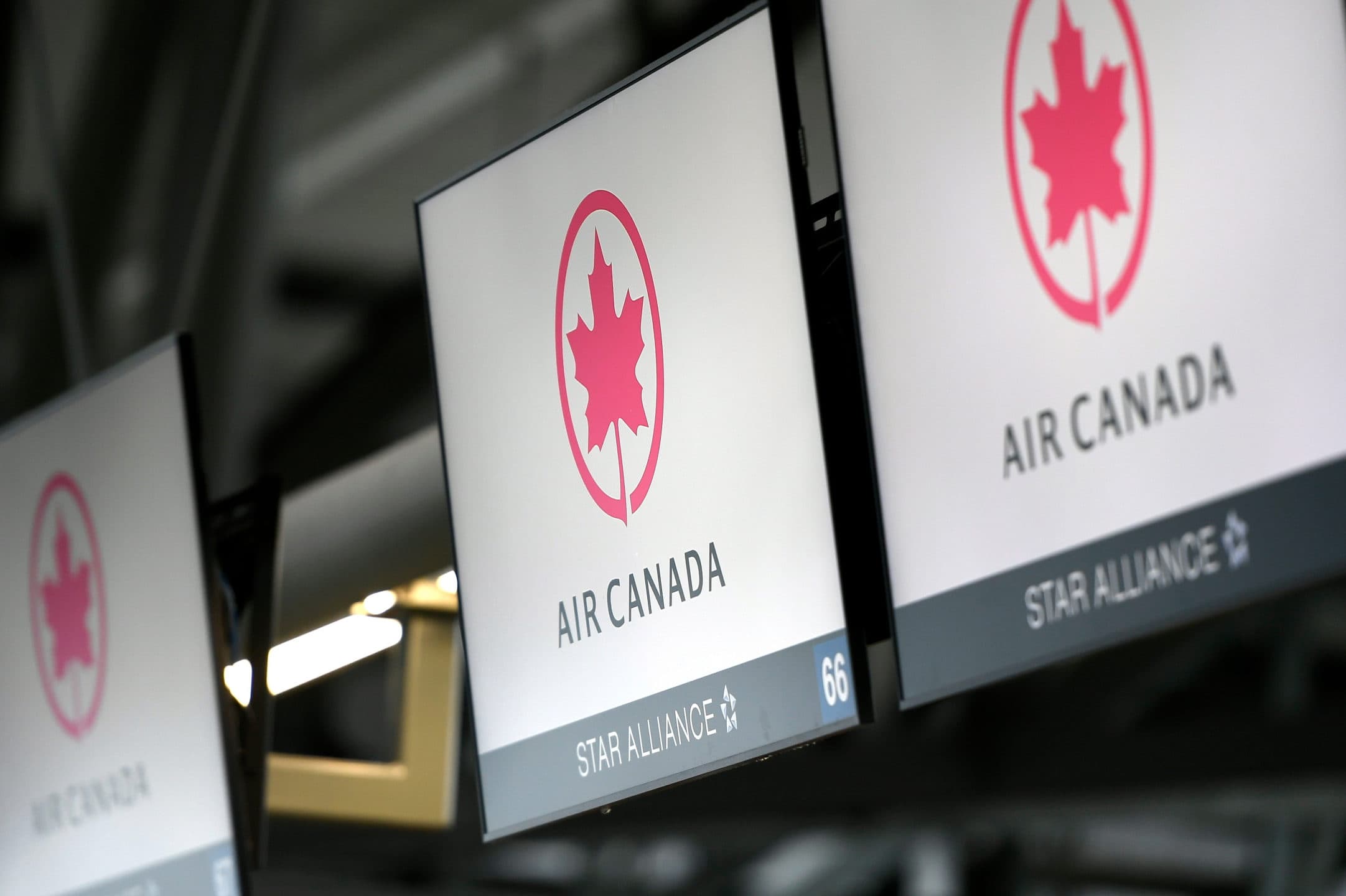 FILE - This May 16, 2020 file photo shows Air Canada check screens at Ottawa International Airport in Ottawa, Ontario, Canada. The U.S. government is seeking to fine Air Canada more than $25 million over what it says have been slow refunds for passengers whose flights were canceled since the pandemic started. The Transportation Department said Tuesday, June 15, 2021, it has received more than 6,000 consumer complaints about Air Canada since March of last year. (Justin Tang/The Canadian Press via AP)